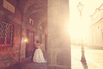 bride and groom in the city on a sunny day