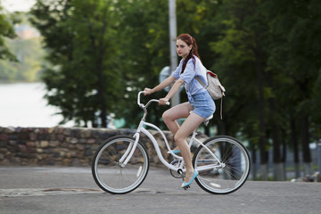 Obraz na płótnie Canvas Girl and white bike