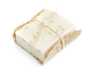 Handmade soap with oatmeal and milk on a white background