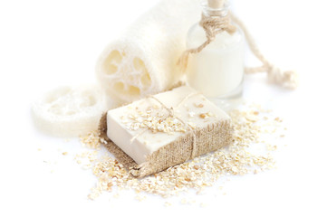 Fototapeta na wymiar Handmade soap with oatmeal and milk on a white background