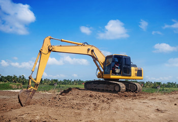 Fototapeta na wymiar Excavator working at construction site