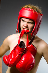Funny boxer against dark background