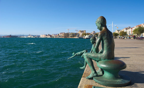 statue of the raqueros in spanish port santander.