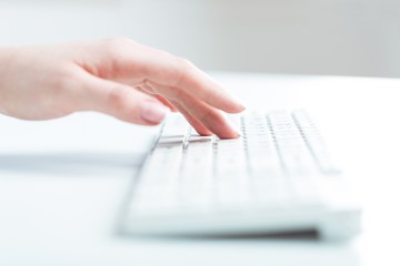 Fototapeta premium Information. Woman's hand typing on computer keyboard