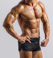 Fototapeta premium Strong bodybuilder with six pac, shoulders,biceps, triceps,chest