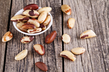 Brazil nuts on a wooden background.