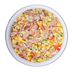 Raw meat with vegetables in a pan isolated on white background