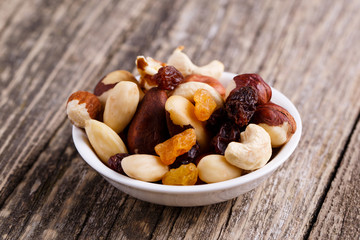 Mixed nuts on a white plate.