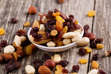 Mixed nuts on a white plate.