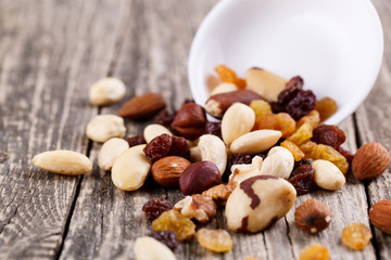 Mixed nuts on a white plate.
