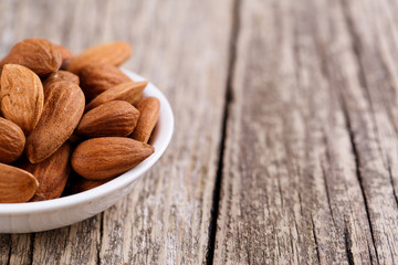 Almonds on a white plate.