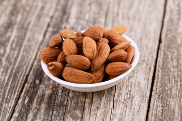Almonds on a white plate.