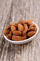 Almonds on a white plate.