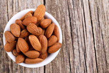 Almonds on a white plate.