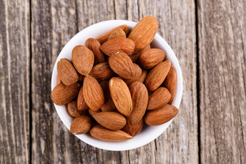 Almonds on a white plate.