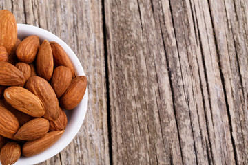 Almonds on a white plate.