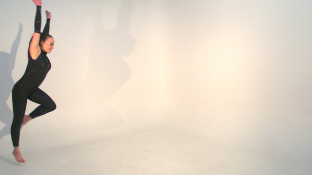 Beautiful young acrobat dance in slow motion