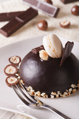 Beautiful chocolate cake with nuts and macaroon, vertical