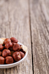 Hazelnuts on a white plate.