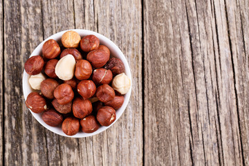 Hazelnuts on a white plate.