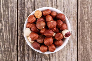 Hazelnuts on a white plate.