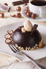 chocolate cake with nuts close-up and coffee, vertical
