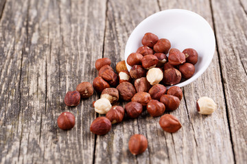 Hazelnuts on a white plate.
