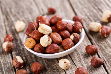 Hazelnuts on a white plate.