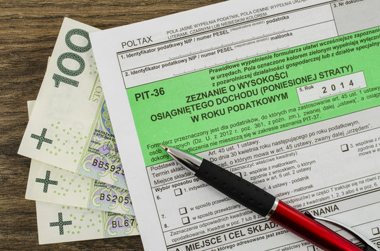 Polish tax form with pen and money