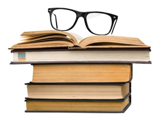 Analyze. picture of a pile of books and eyeglasses, with a retro
