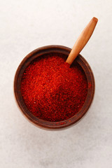 top view of a chilli powder in wooden container