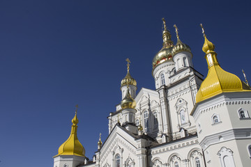 Fototapeta na wymiar Architecture of the Orthodox Church and golden domes