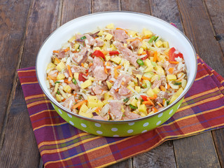 Raw meat with vegetables in a pan, stew