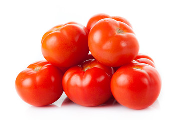 Fresh tomatoes isolated on white. Closeup of tomatoes