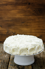 cake with vanilla cream in the form of roses