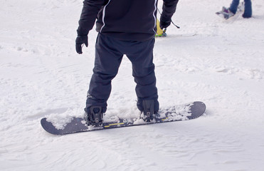 A snowboarder descends from the mountain