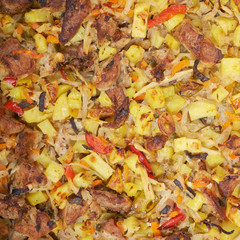 Meat with vegetables, stew on a wooden table