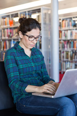 Studying on a Laptop at Library