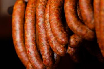 Traditional food. Smoked sausuages in smokehouse.
