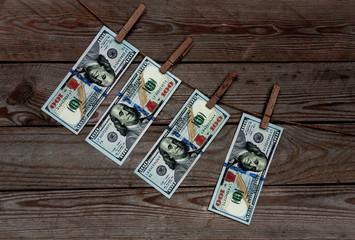 Fototapeta na wymiar dollars on wooden background