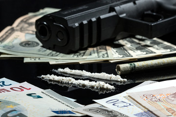 Illegal drugs , money and guns - 80349576