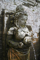 Fototapeta na wymiar religious figure at holy hinduism fountain in bali