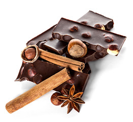 Chocolate and nuts with cinnamon sticks, star anise isolated