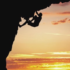 silhouetted rock climber