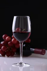 Fotobehang Wineglass, bottle and grape © Volodymyr