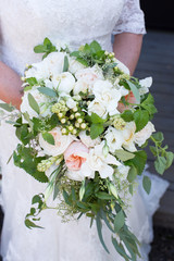Bride Holding a Bouquet of Flowers