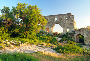 Fototapeta na wymiar Old citadel ruins on sky background. Mangup Kale, Crimea