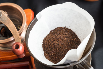 Freshly ground coffee with a mill or grinder
