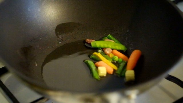 Putting mexican vegetables mix in vog pan