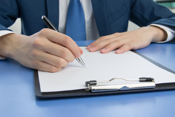 Businessman signing documents in the office